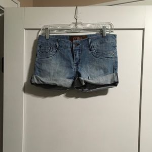 C. Pink jean shorts.